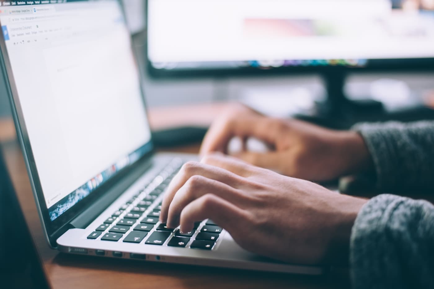 Laptop open on a desk for sending a message